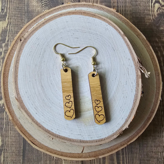 Rectangular wood earrings with engraved hearts - $15.00 - Moon Cabin Creations